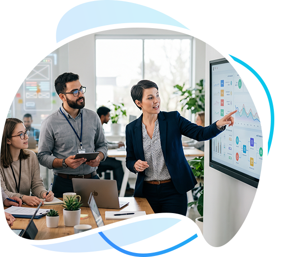 Servidge team collaborating around a business dashboard